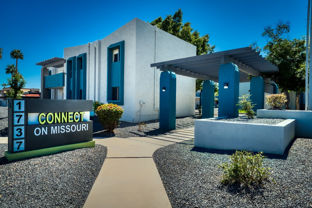 a building with a sign in front of it a building with a sign in front of it at Connect on Missouri, Phoenix Arizona