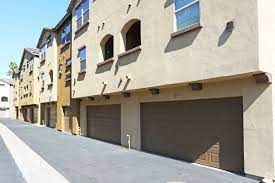 a row of garage doors on the side of a building