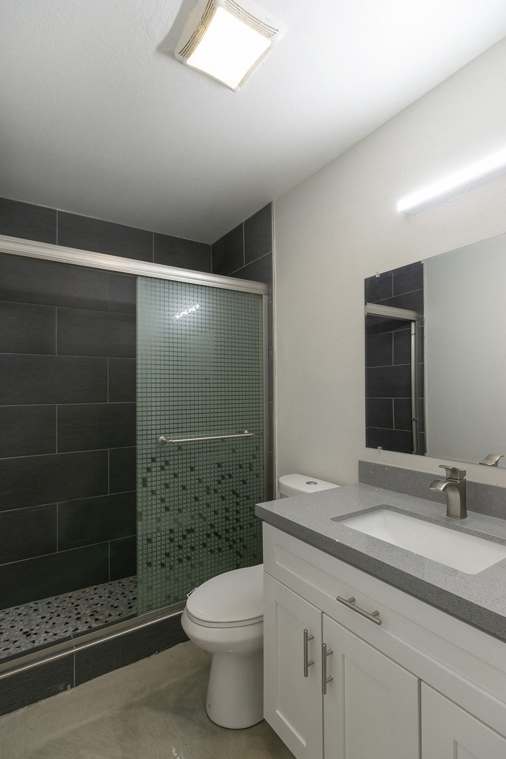 an image of a bathroom with a shower toilet and sink