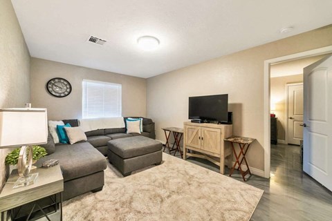 a living room with a couch and a tv