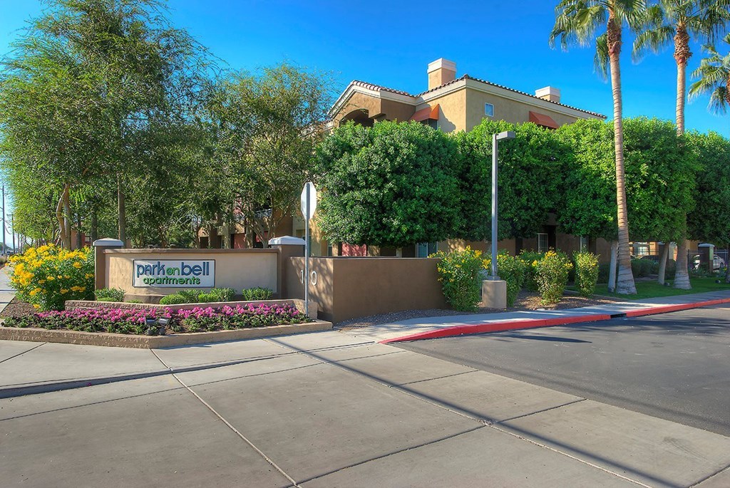 a building with a sign on the side of a street