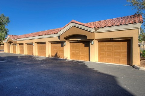 a row of garage doors on a parking lot
