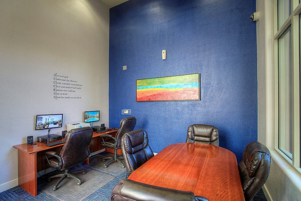 a conference room with a conference table and chairs