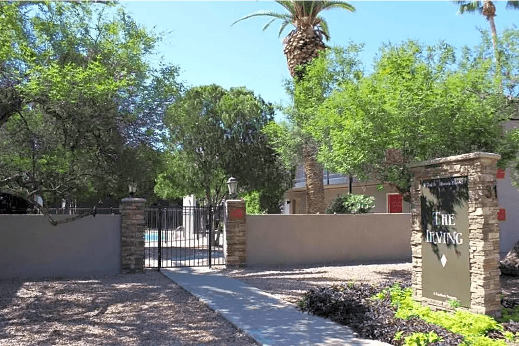 a gate with a sign that reads the flying    in front of a