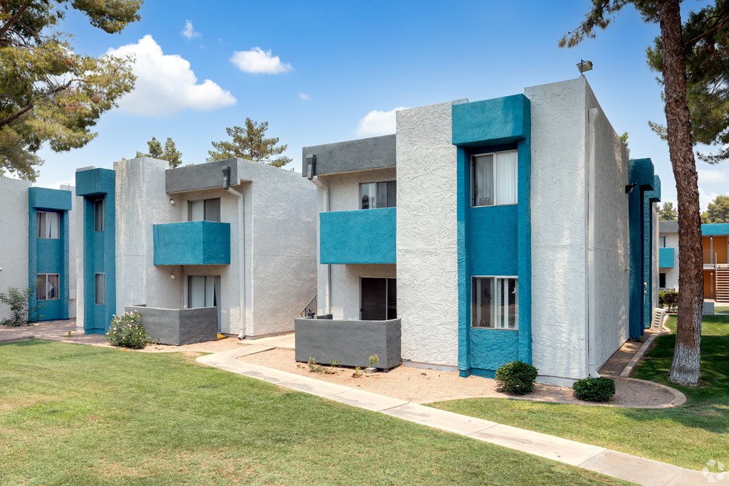A row of modern style houses with blue trim. at Sycamore Square  Apartments, Mesa, AZ