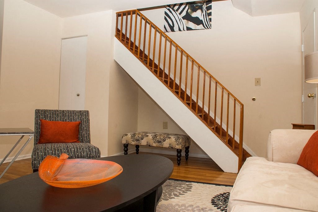 living area with sofa, coffee table and staircase at ridgecrest village in washington dc