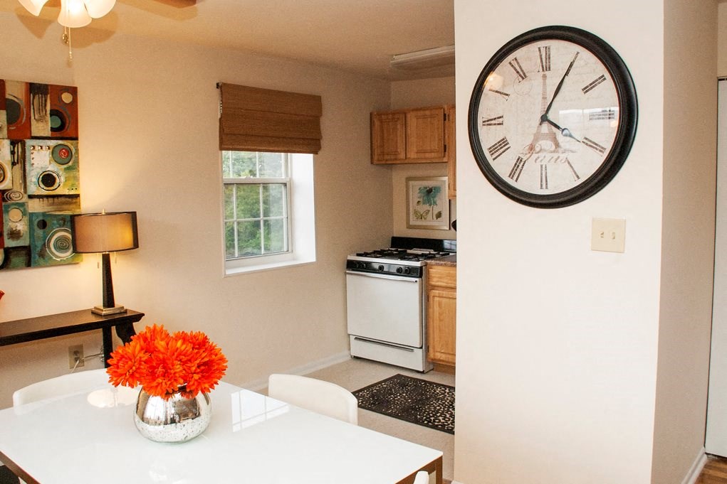 Dining area with view of kitchen with window and energy efficient appliances at ridgecrest village in washington dc
