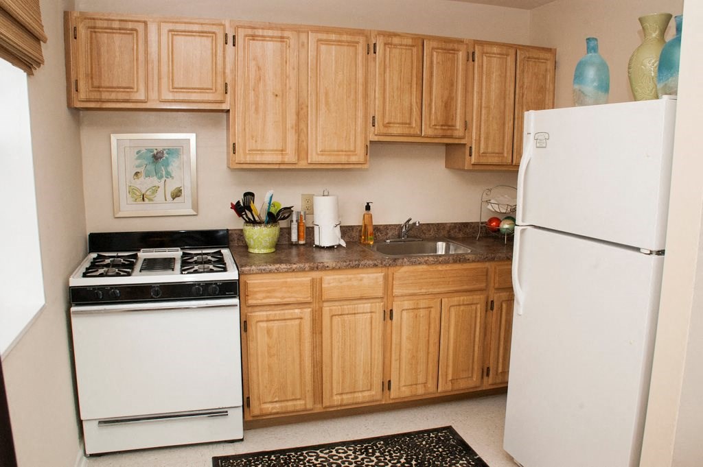 kitchen with gas range, wood cabinetry and energy efficient appliances at ridgecrest village in washington dc