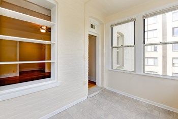 vacant sunroom with hardwood floors and large windows at twin oaks apartments columbia heights washington dc - Photo Gallery 14
