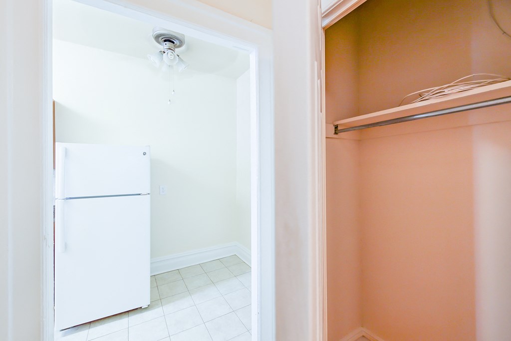 hallway view of kitchen and closet at chatham courts apartments in washington dc