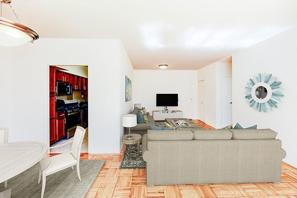 living area with sofa, coffee table, credenza, tv, hardwood floor and views of kitchen at dining area at clarence house apartments in washington dc