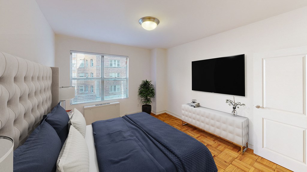 bedroom with bed, night stands, dresser, tv and large window at clarence house apartments in washington dc