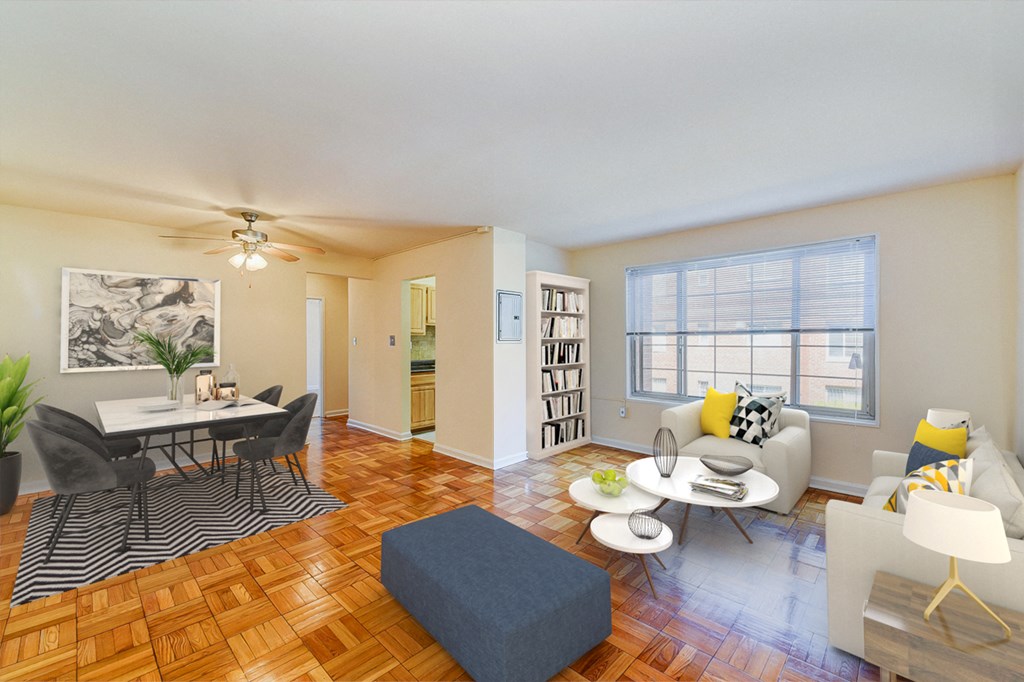 living area with sofa, coffee table, large windows, hardwood flooring and view of dining area at new horizon apartments in washington dc