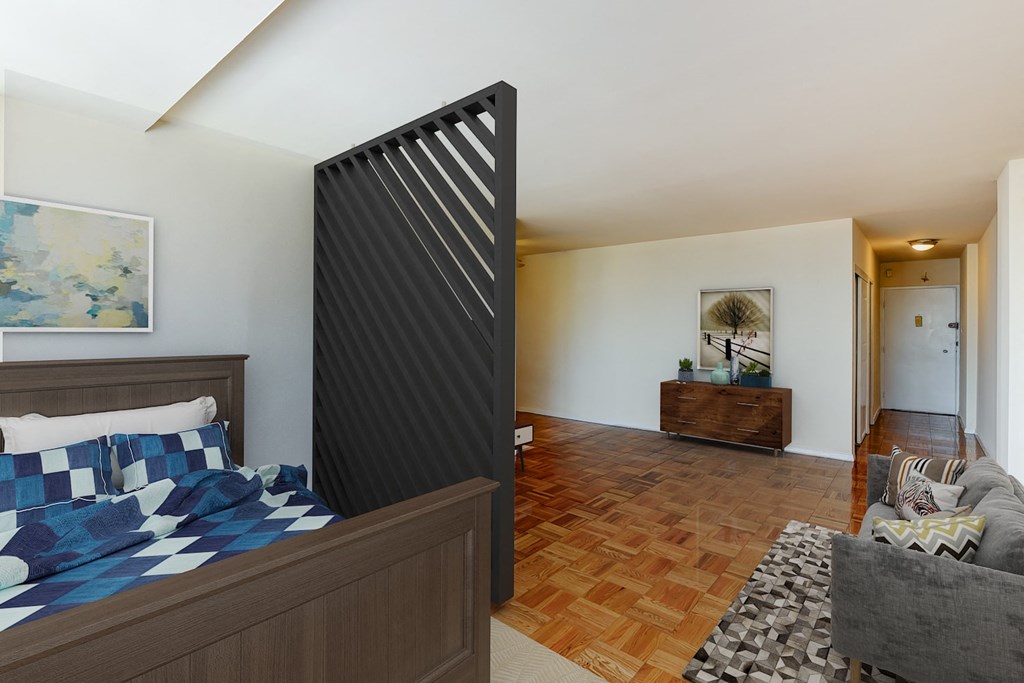 studio apartments showing bed, sofa and front entrance at brunswick house apartments in dupont circle washington dc