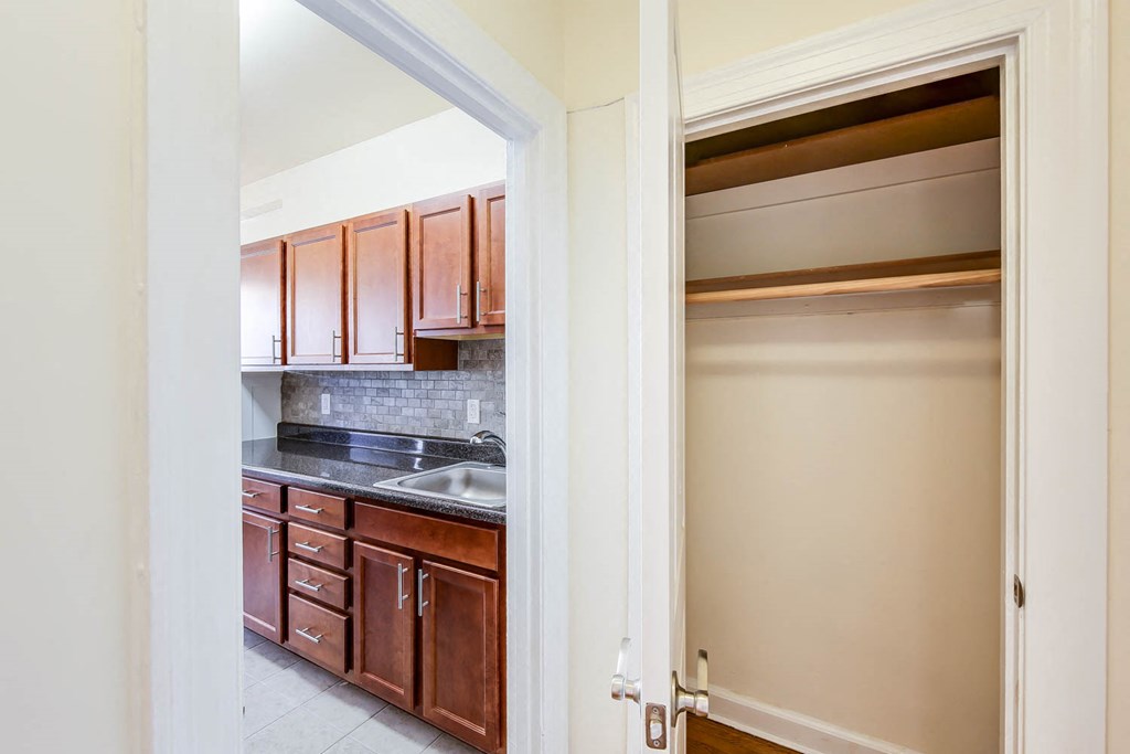 hallway view of large closet and kitchen at the frontenac apartments in van ness washington dc