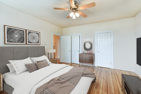 bedroom with bed, nightstand, hardwood floors, and ceiling fan at  2701 Connecticut apartments in washington dc