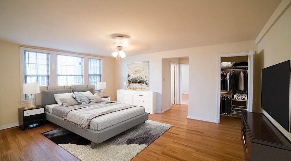 a bedroom with a bed and a dresser at 3101 Pennsylvania apartments in washington dc