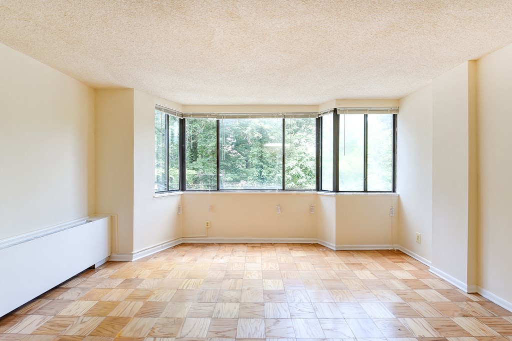 vacant living area with large windows at twin oaks apartments columbia heights washington dc