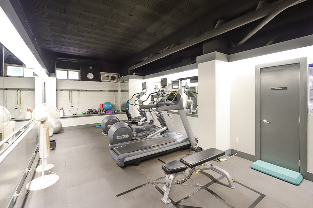 fitness center with work out machines at the baystate apartments in washington dc
