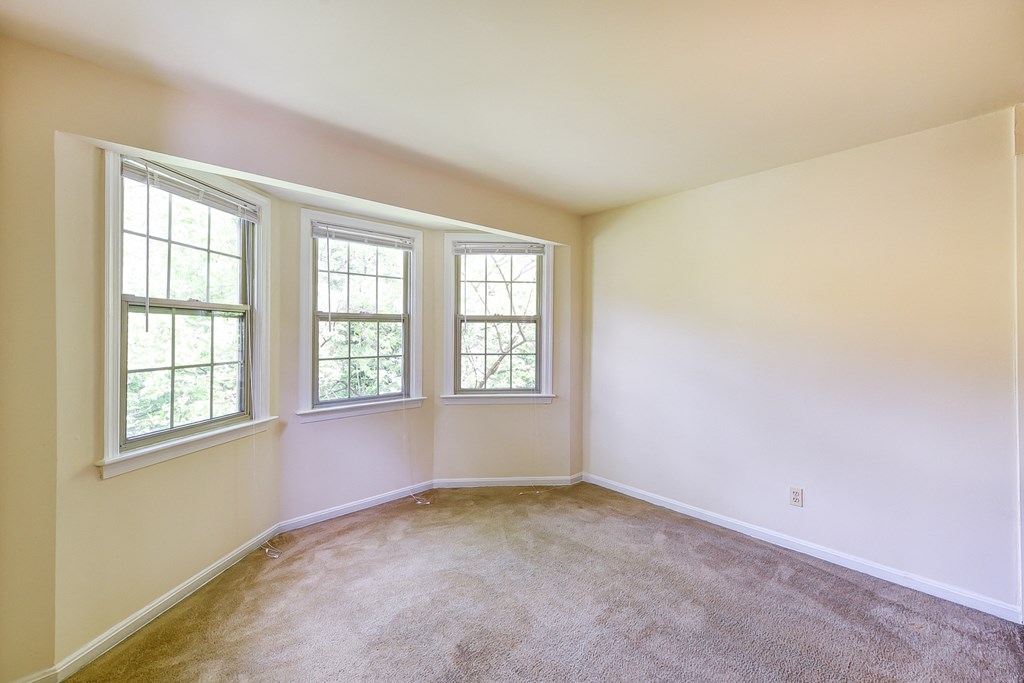 vacant sunroom with bay windows  at  2629 39th Street apartments in washington dc