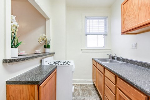 a kitchen with granite counter tops and a stove