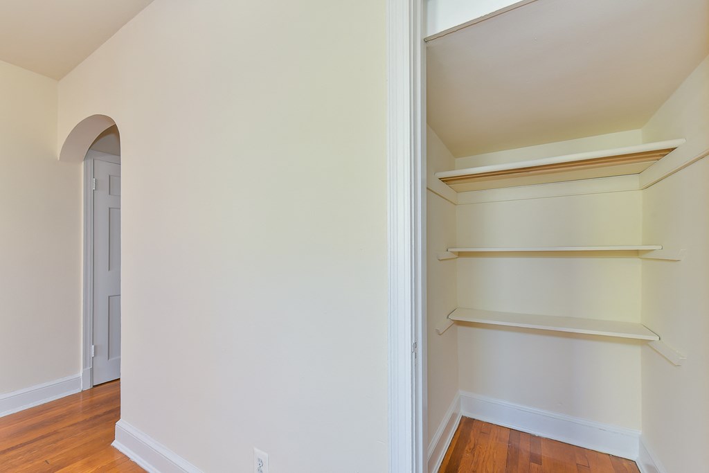hallway closet with built in shelving at 4020 calvert street apartments in washington dc