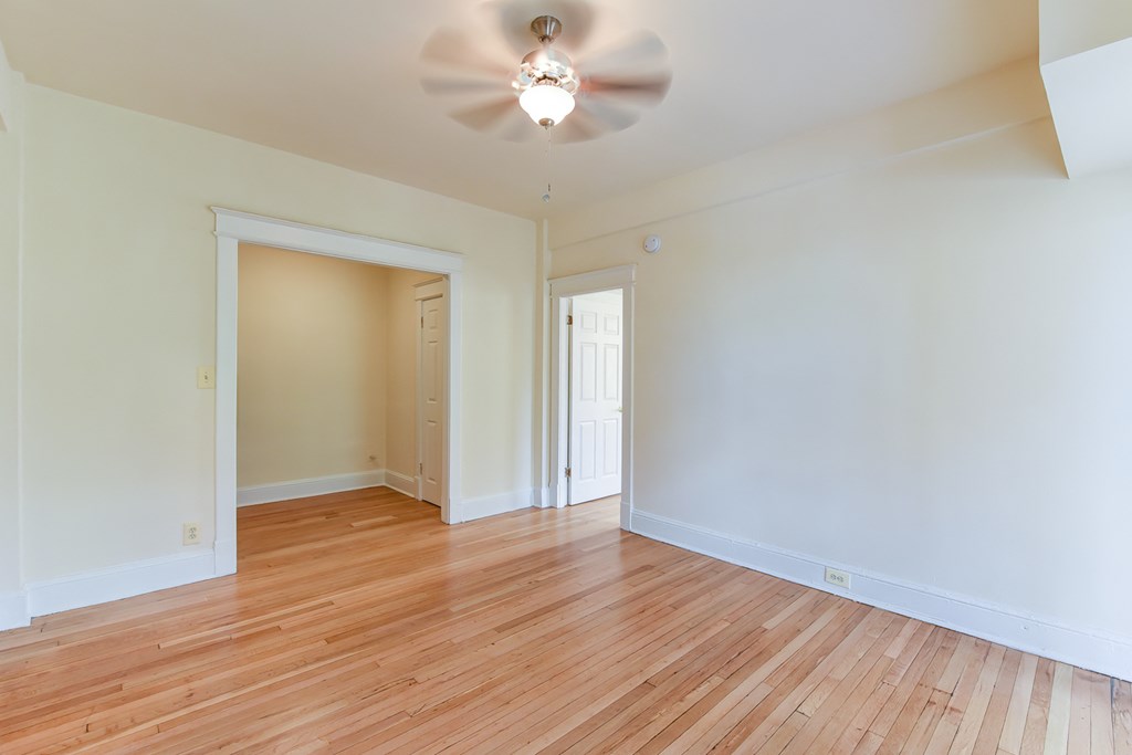 vacant bedroom with hardwood floors, large closet and ceiling fan  at twin oaks apartments columbia heights washington dc