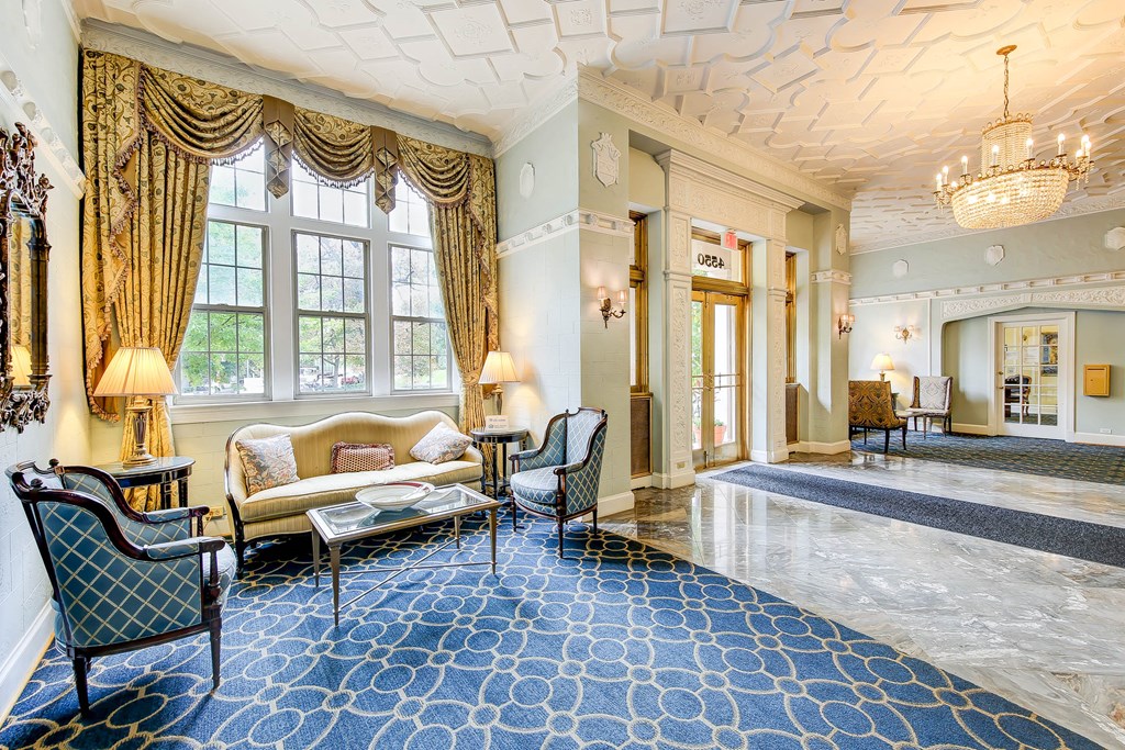 lobby lounge with social seating, large windows and chandelier at the frontenac apartments in van ness washington dc