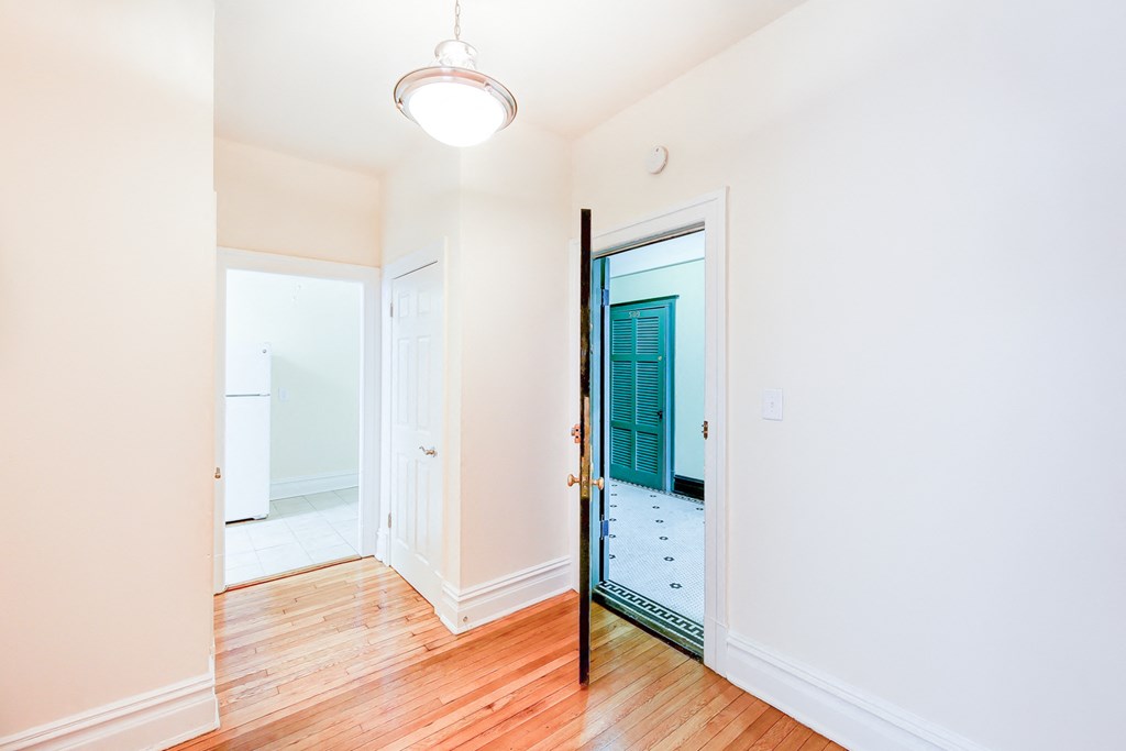 foyer of apartment with modern lighting and hardwood flooring at chatham courts apartments in washington dc