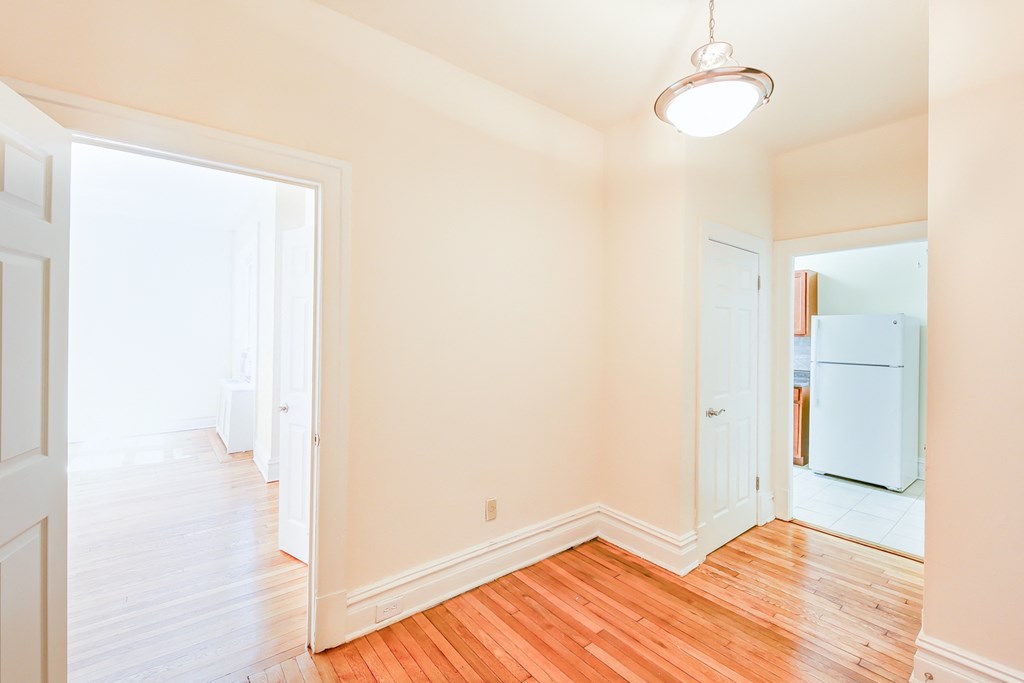hallway with modern lighting and view of kitchen at chatham courts apartments in washington dc