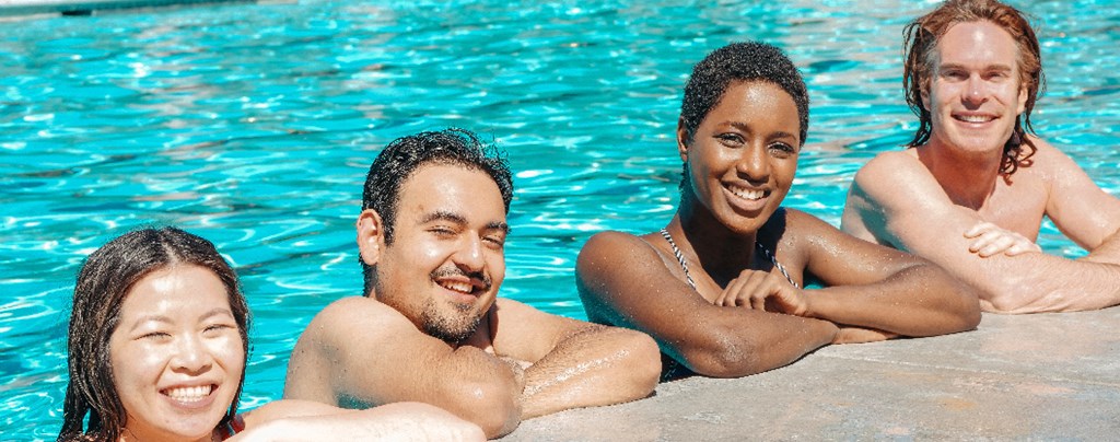 friends hanging out in swimming pool