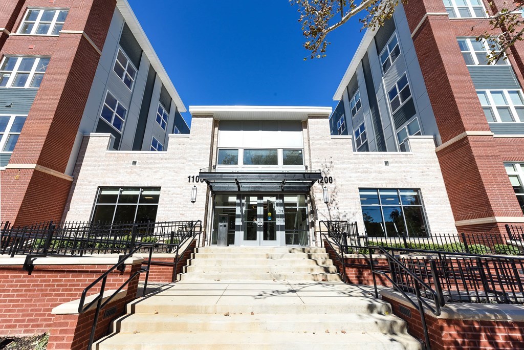 exterior of midrise apartment building at archer park apartments in southeast dc