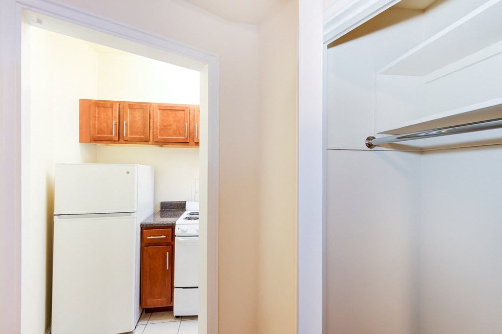 hallway view of kitchen and closet at baystate apartments in washington dc