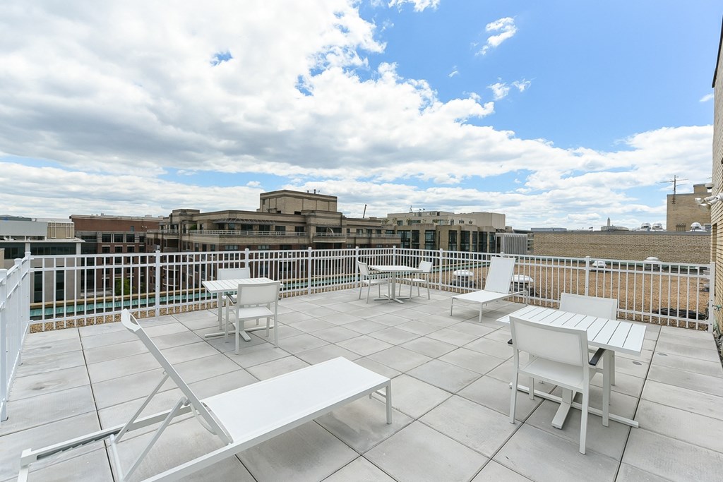 rooftop lounge with lounge chairs, social seating and tables at brunswick house apartments in dupont circle washington dc