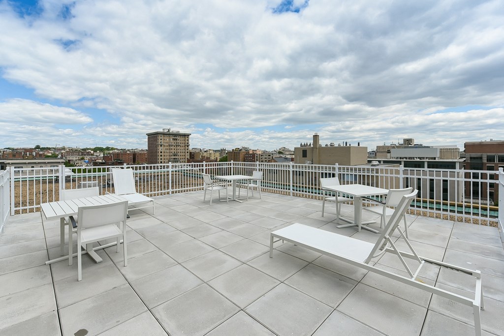 rooftop lounge with lounge chairs, social seating and tables at brunswick house apartments in dupont circle washington dc