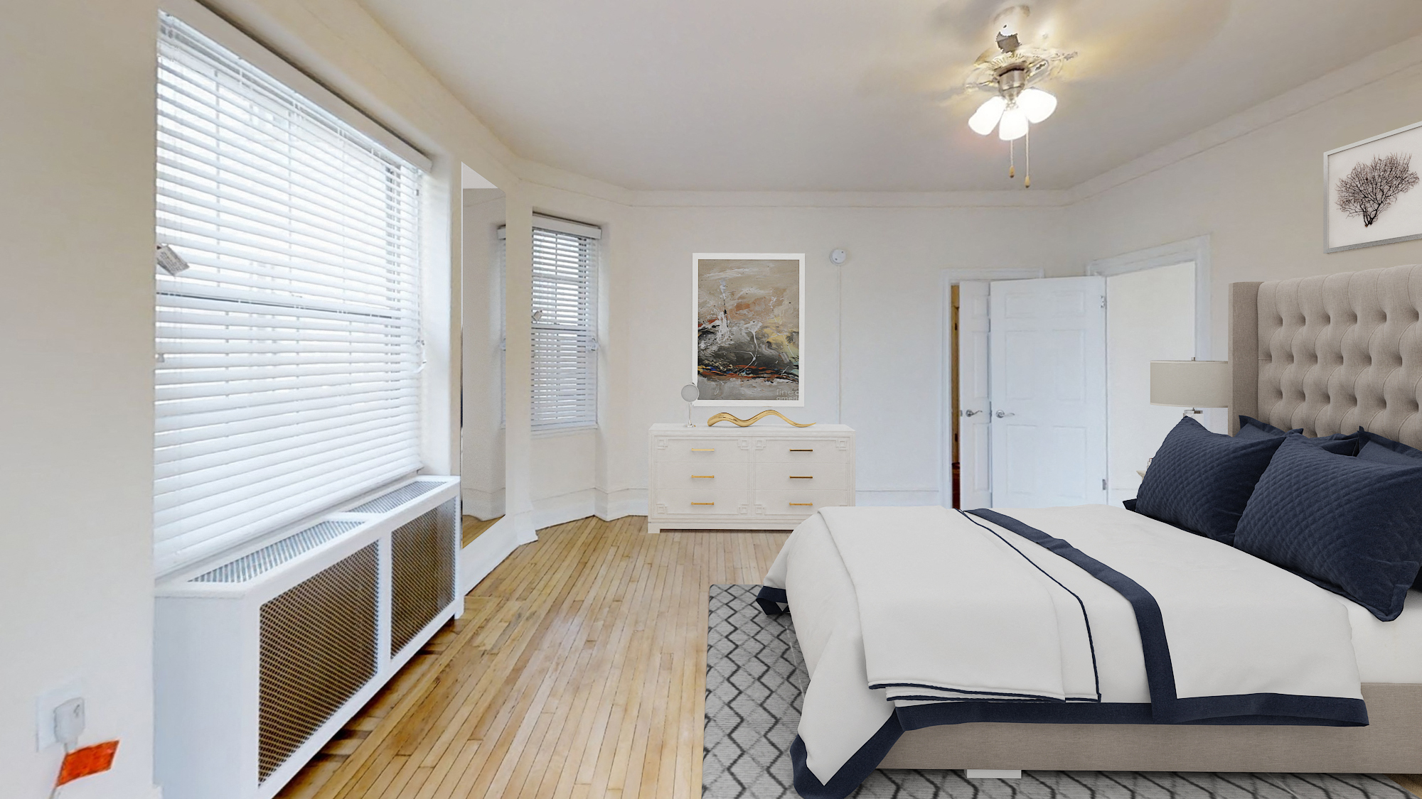 bedroom with bed, dresser, night stands, tv, ceiling fan and large windows at the calvertion apartments in washington dc