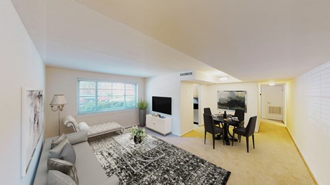 a living room and dining room with a couch and a table