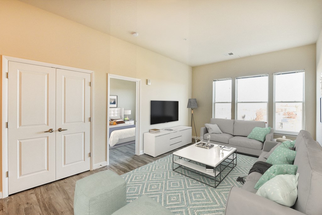living area with sofa, coffee table, large windows, credenza, tv and view of bedroom at city view apartments in washington dc