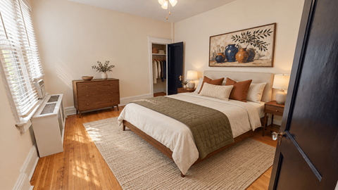 A bedroom with a large bed and a painting on the wall.
