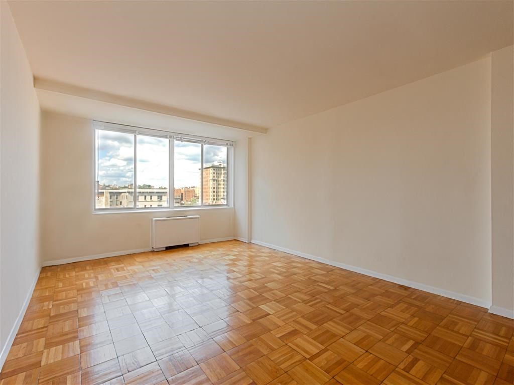 vacant apartment with hardwood flooring and large windows at brunswick house apartments in dupont circle washington dc