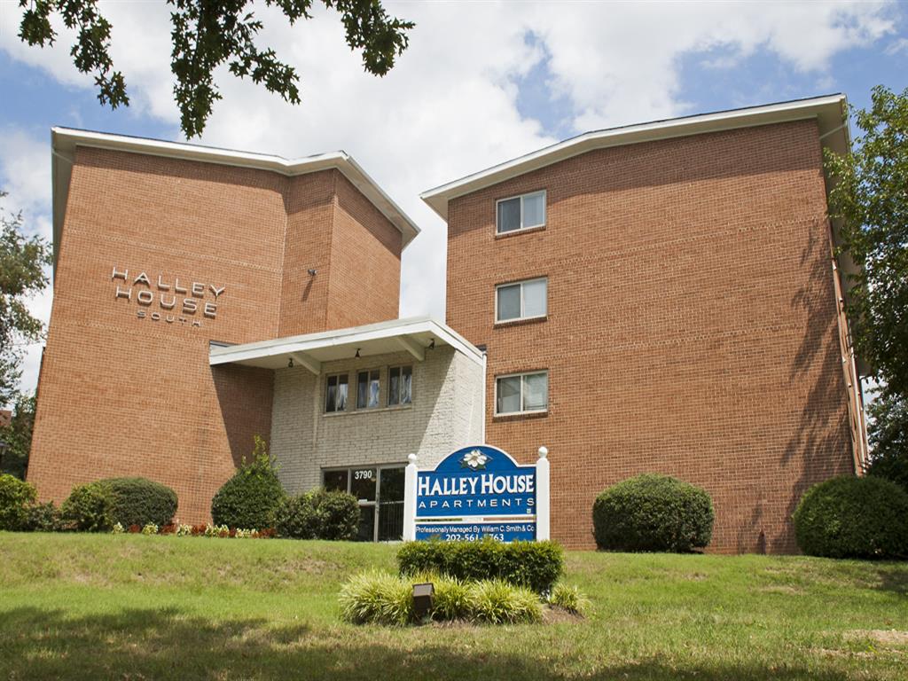 exterior of three story brick apartment building - halley house apartments in washington dc