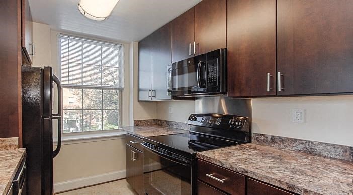Juniper-Courts-Kitchen kitchen with espresso cabinetry, window and energy efficient appliances at juniper courts apartments in takoma washington dc
