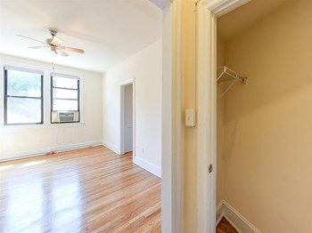 large closet with view of living area at the klingle apartments in washignton dc - Photo Gallery 8