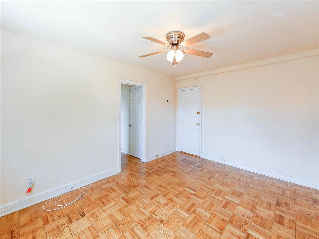 vacant bedroom with hardwood floors, closet and ceiling fan at the meridian park apartments in columbia heights washington dc