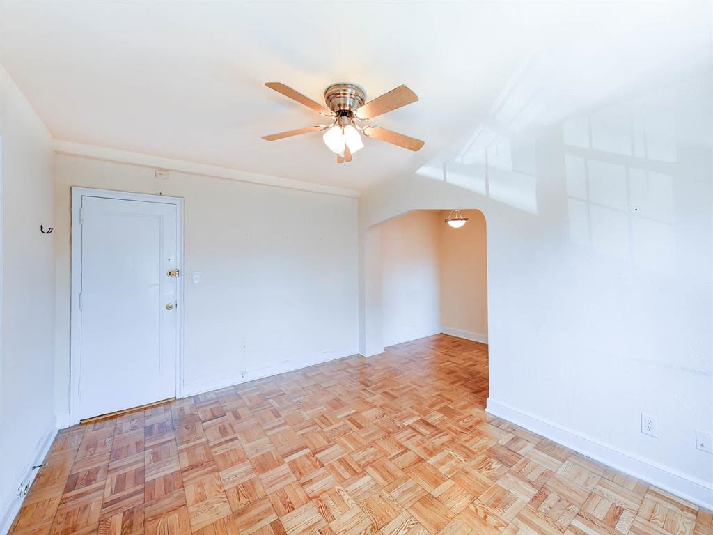 vacant bedroom with hardwood floors, closet and ceiling fan at the meridian park apartments in columbia heights washington dc