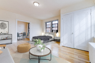 studio living area with sofa, coffee table, decorative shelving, and view of bedroom area at the dahlia apartments in washington dc
