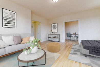 studio living area with sofa, coffee table, decorative shelving, and view of kitchen  at the dahlia apartments in washington dc