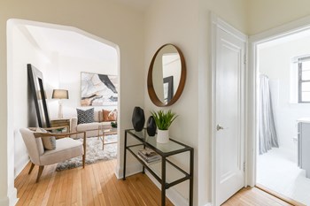 hallway view of living area and bathroom at the dahlia apartments in washington dc - Photo Gallery 11