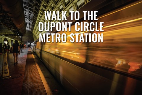 A subway station with a sign that says "Walk to the Dupont Circle Metro Station".