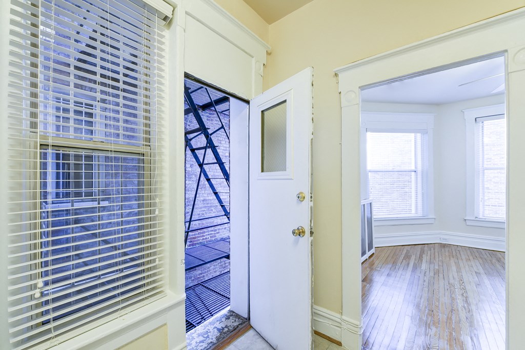 hallway with view of living area and balcony at dupont apartments in washington dc